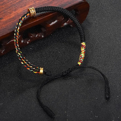 Bracelet Moine Tibétain Tressé Noir Et Jaune