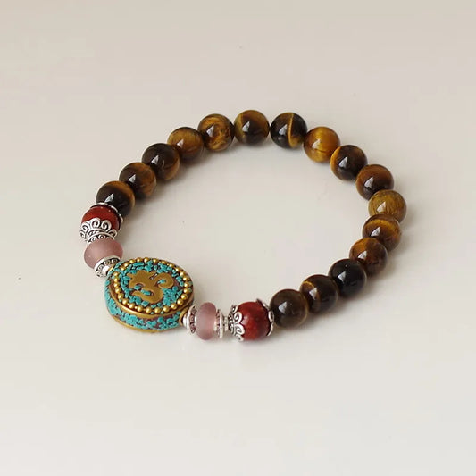 Détail perles oeil de tigre naturel avec reflet chatoyant bracelet tibétain
