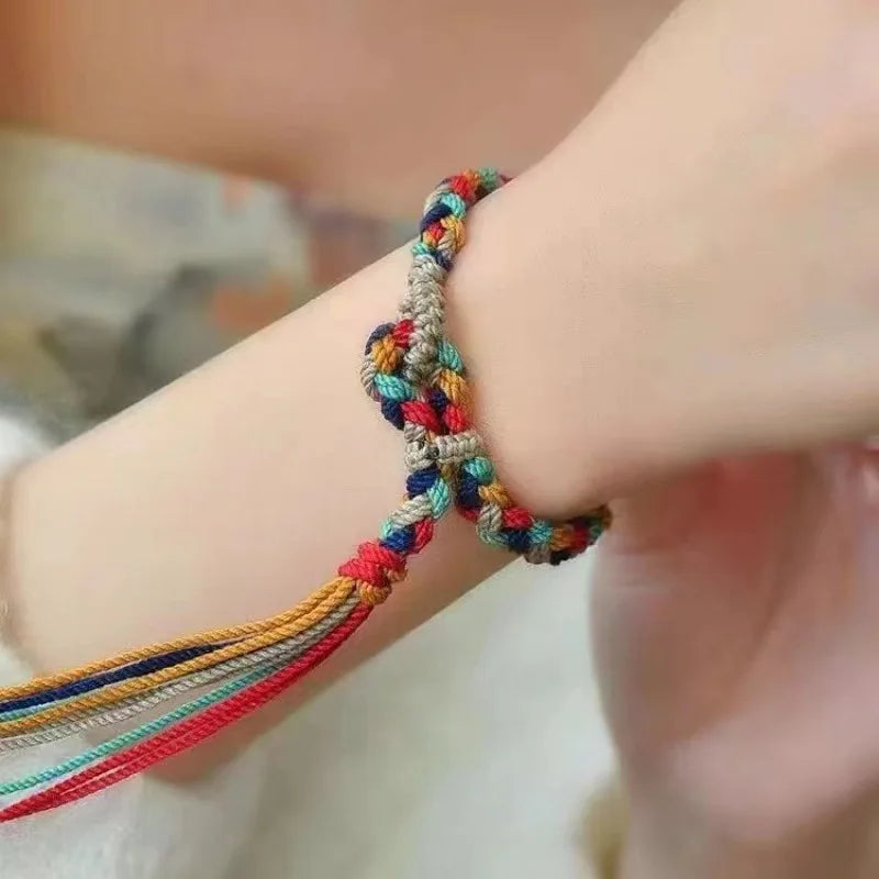 Tressage artisanal bracelet tibétain femme motif himalaya