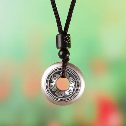 Pendentif Om en métal argenté, vue de dos, cadeau symbole Om bouddhiste