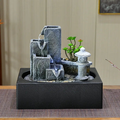 Fontaine zen intérieur en résine grise mate avec effet cascade, vue de face