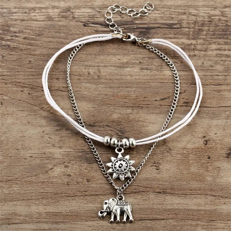 Bracelet de cheville éléphant porté à la cheville, finition dorée alliage de zinc